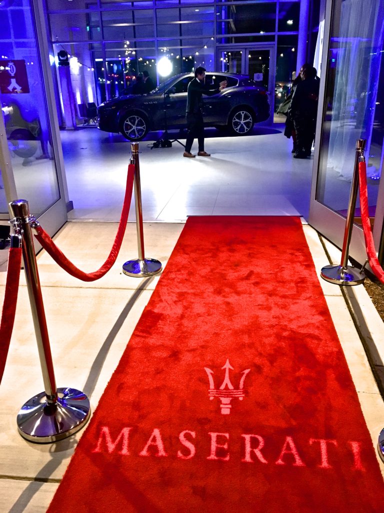 Maserati red carpet event, stanchion, monogram, spotlights, uplights